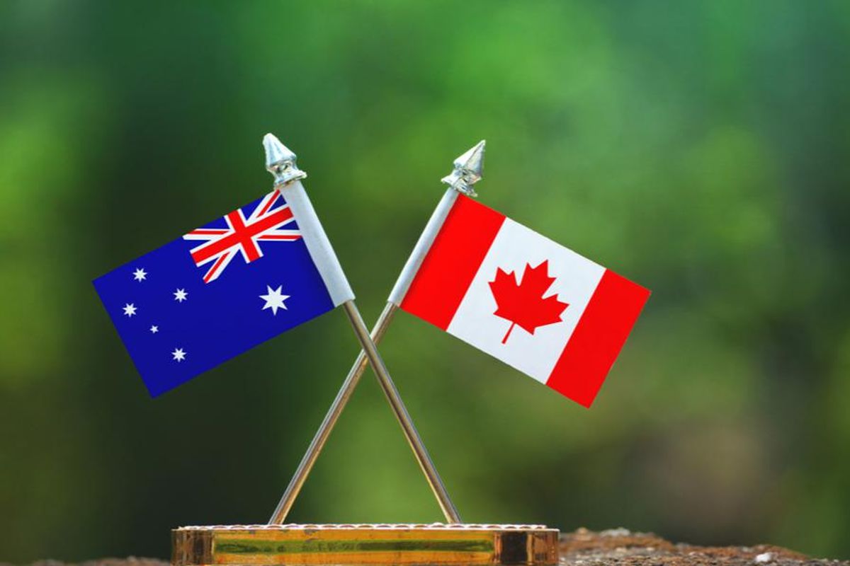 small australian and canadian flags crossing each other