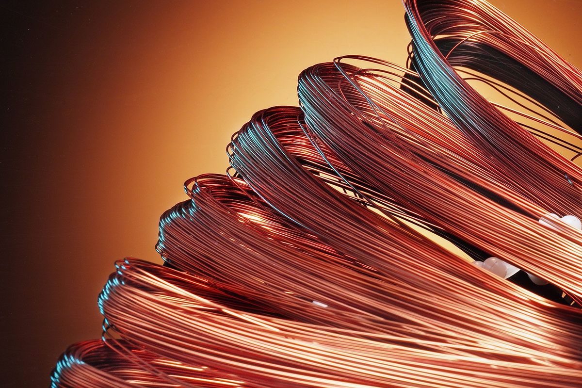 Spools of copper wires laying on their side.