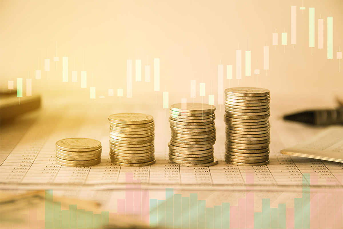 Stack of gold coins with price graph.