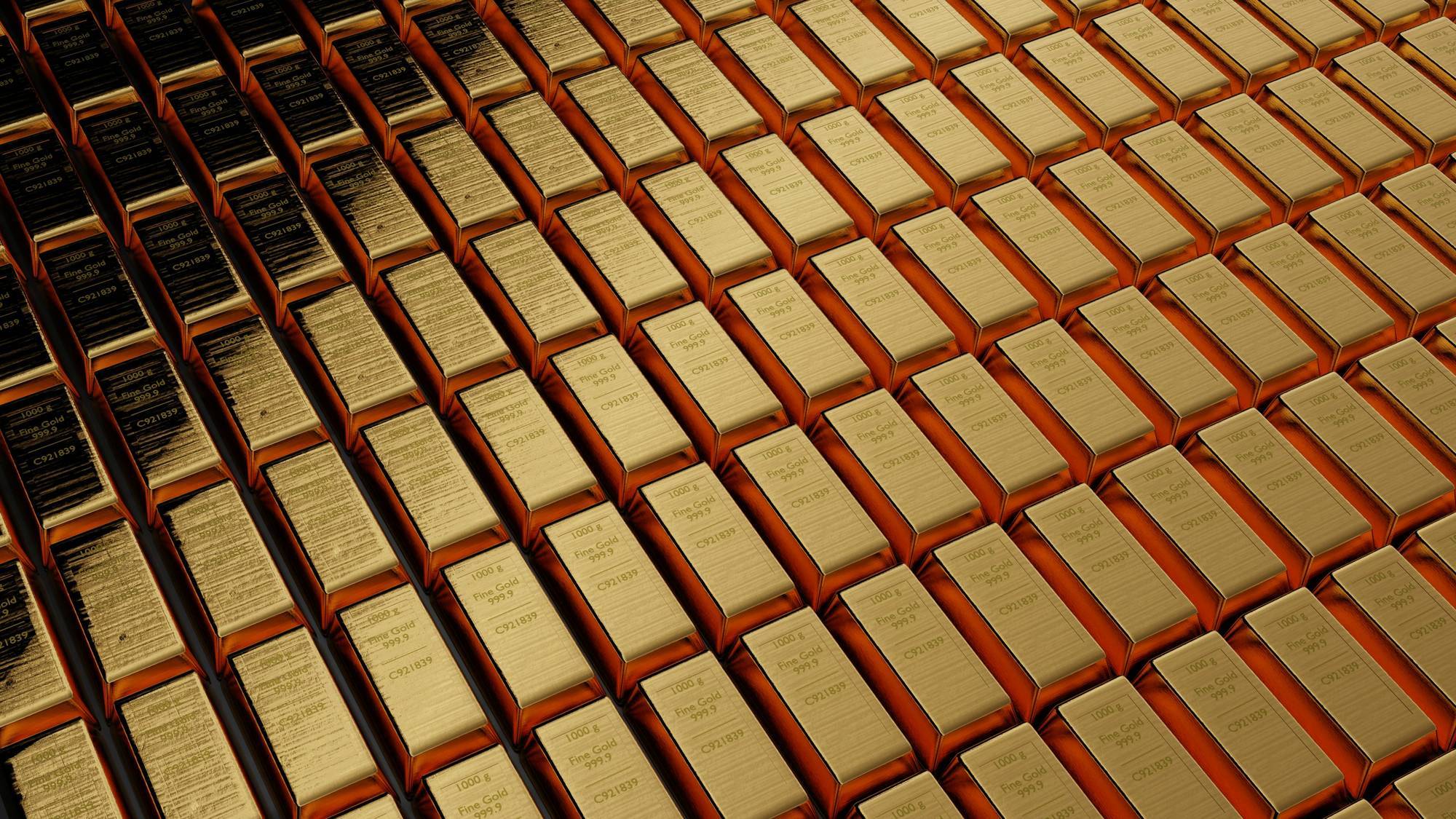 Stacks of gold bars arranged in neat rows.