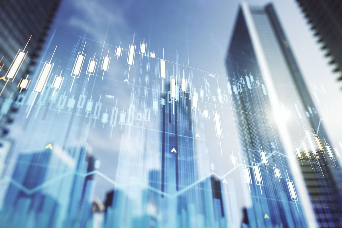 Stock chart over cityscape.