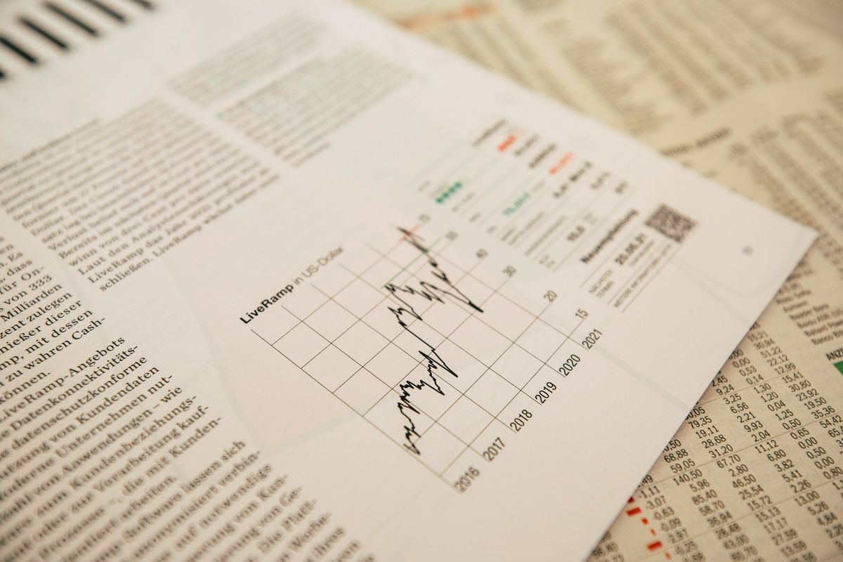 Stock charts in newspaper.