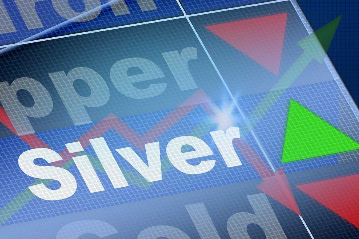 Stock market graphic showing "Silver" with green and red arrows.