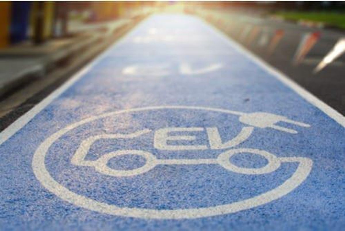 stretch of blue pavement indicating EV parking