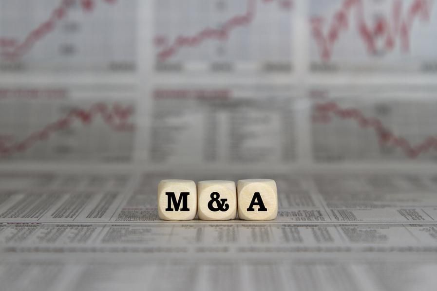 the characters M&A displayed on wooden blocks