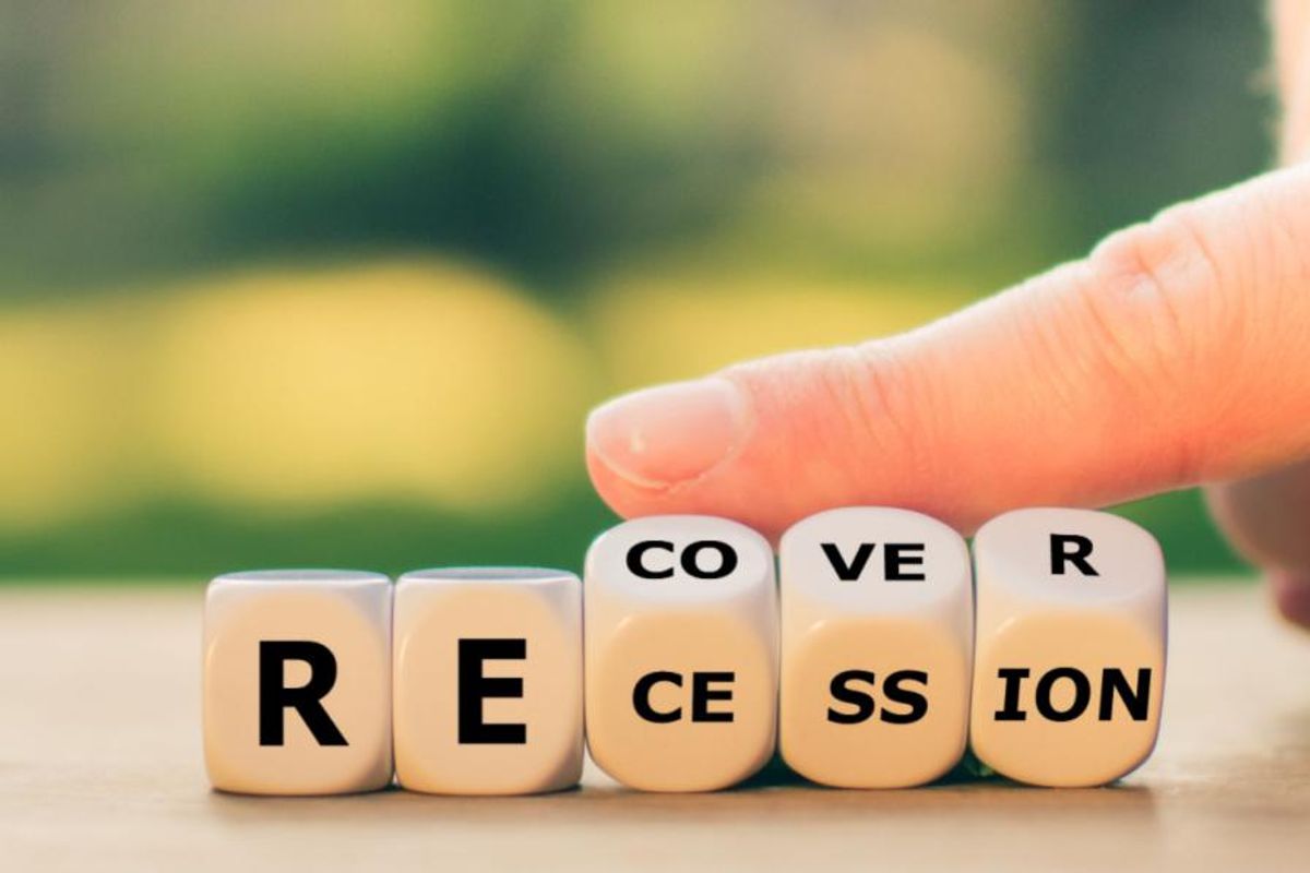 the word RECESSION written on wooden blocks, with the CESSION blocks turning to read RECOVER