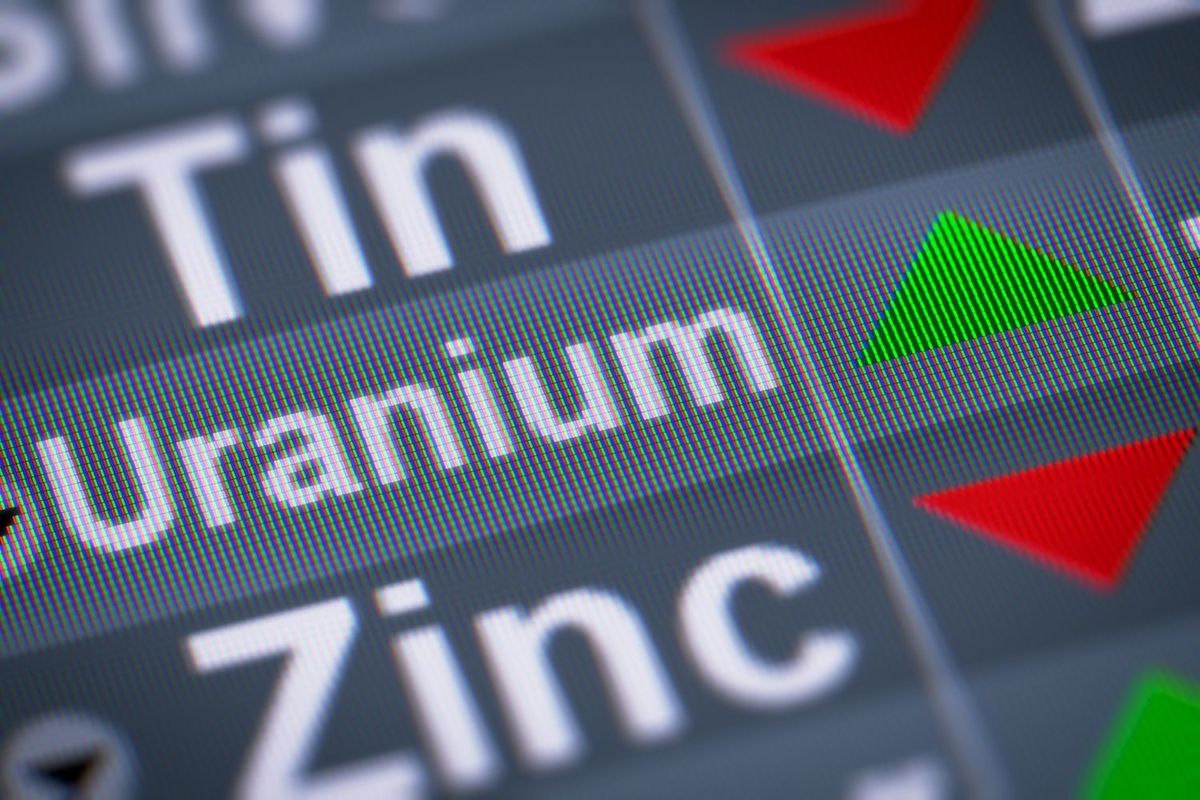 The word uranium with a green arrow pointing up. 