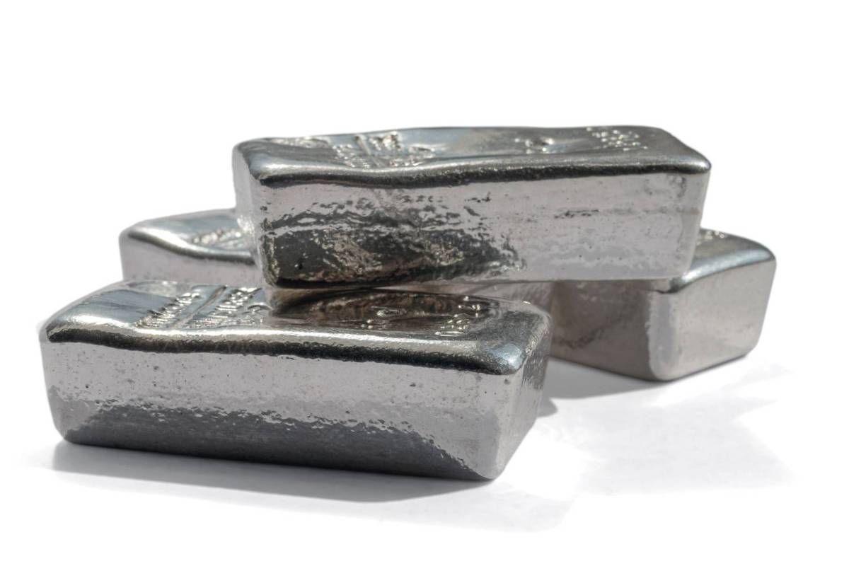 Three platinum and palladium bars stacked unevenly on a plain white surface.