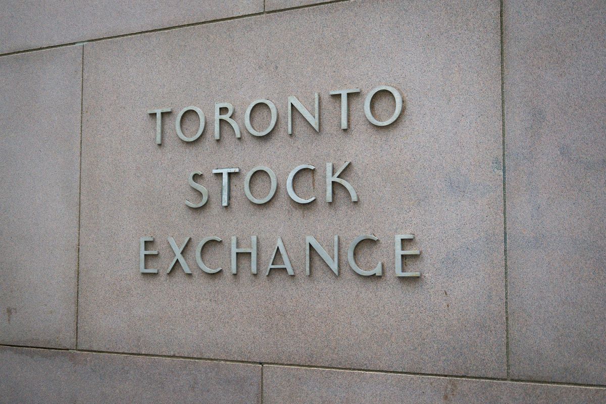 Toronto Stock Exchange sign on a stone wall.