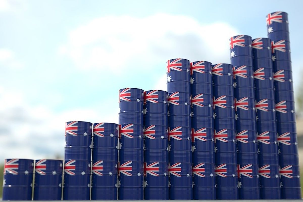 Tower of shipping drums with Australian flags on each. 