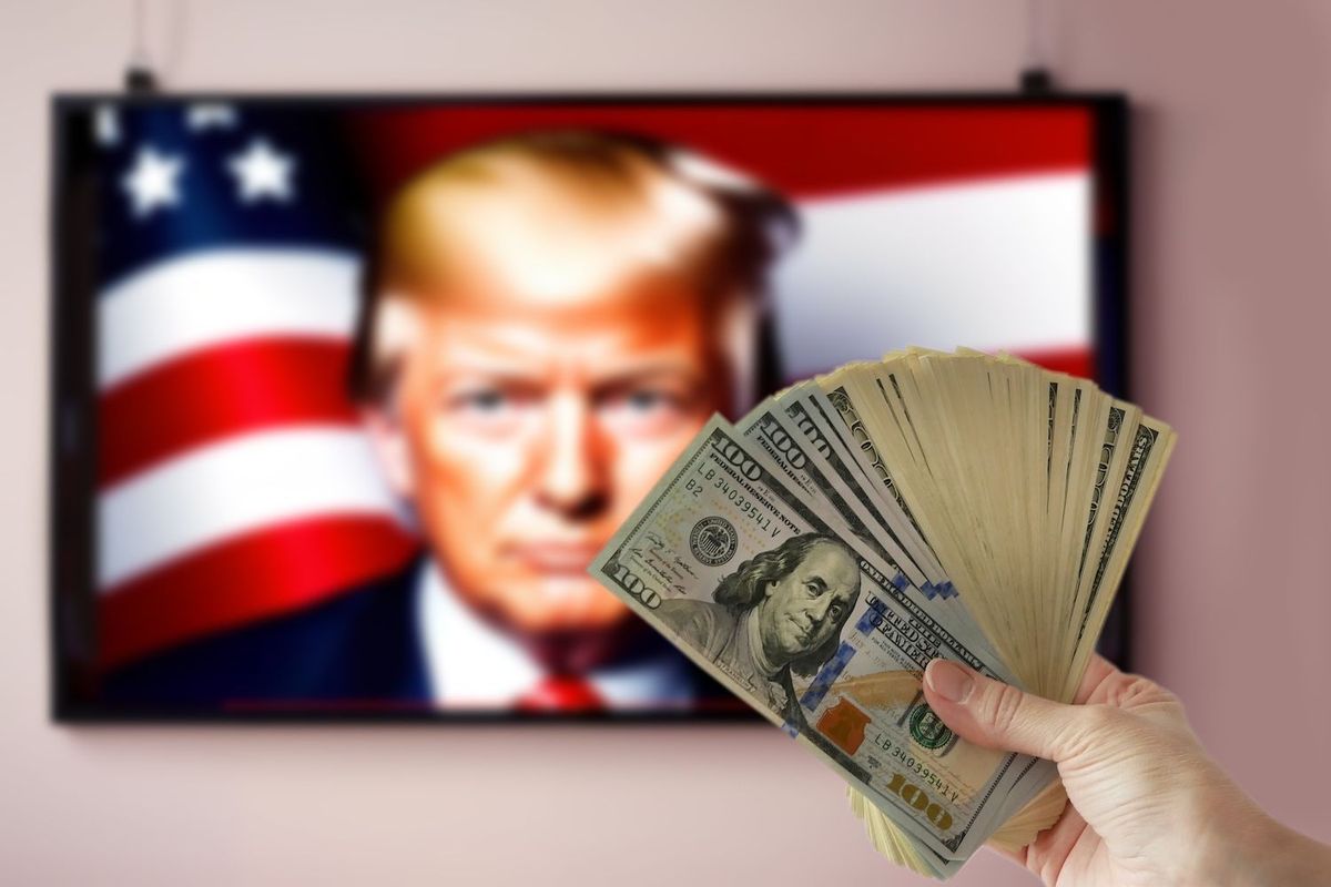 TV screen with picture of Donald Trump and a handful of money.