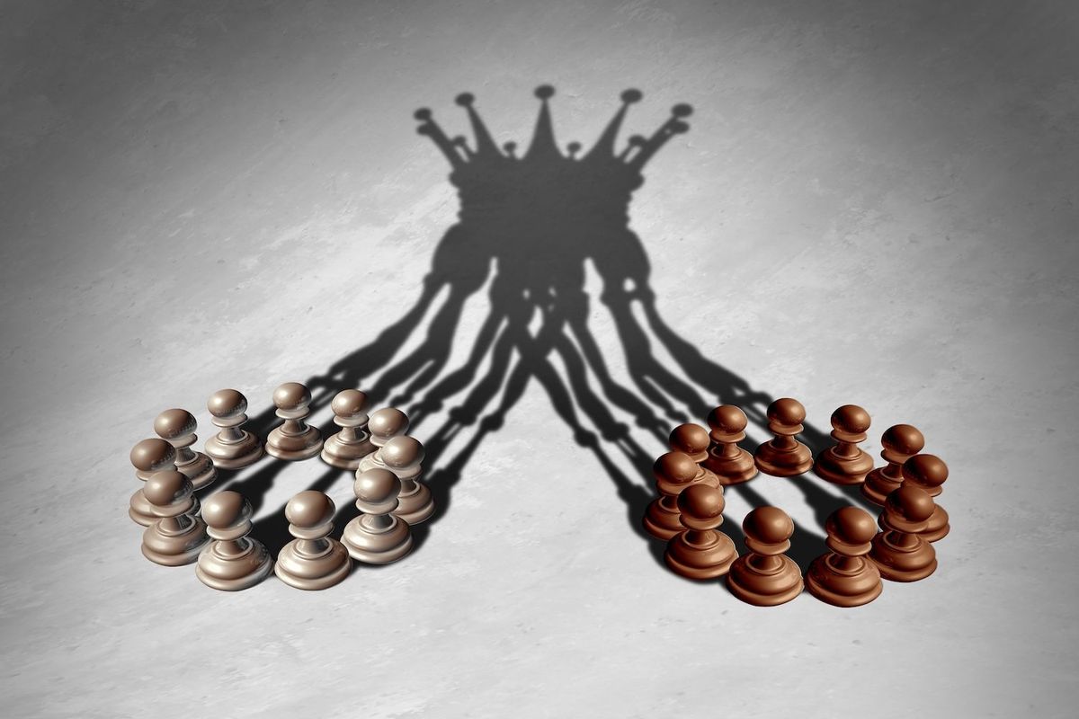 Two groups of chess pieces merging.