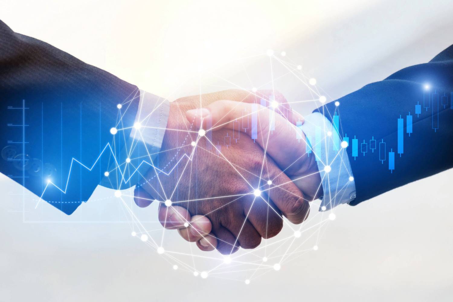 Two people in suits shaking hands with overlay of digital graphs and network lines.