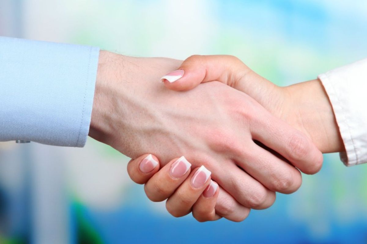 two people shaking hands