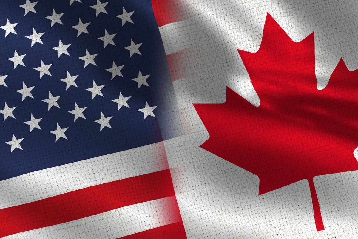 US and Canadian flags.