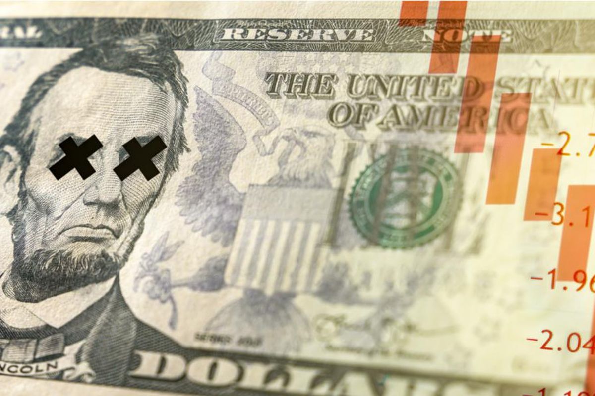 us dollar bill with downward trend lines