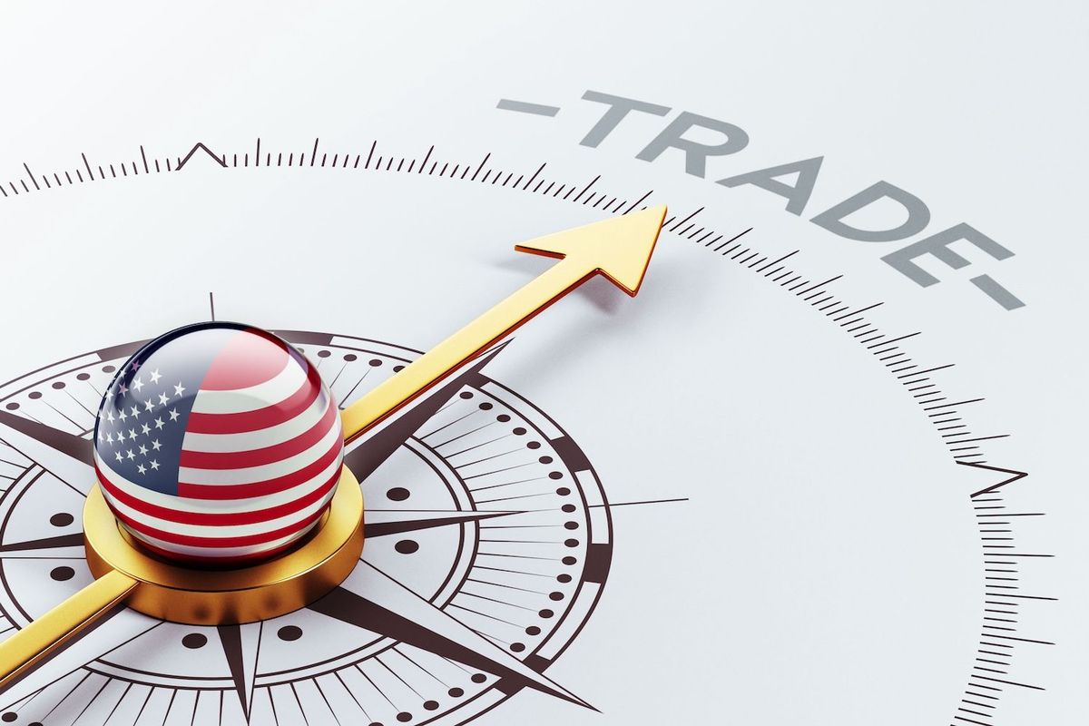 US flag on compass pointing to the word "trade."