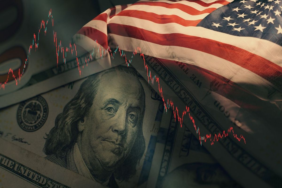 US money, US flag and red stock chart.