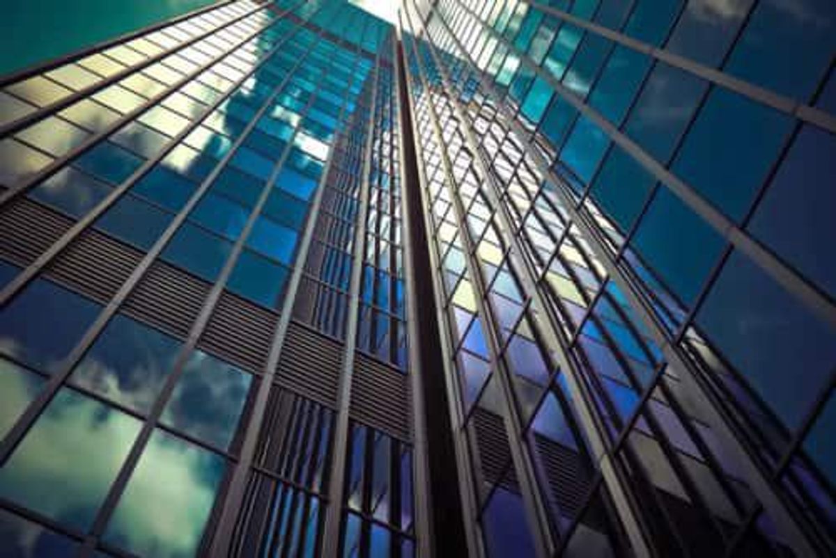 view from the ground staring up at skyscrapers