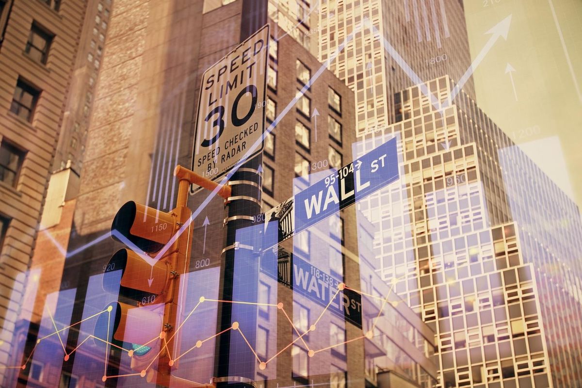 Wall Street signs with rising stock chart overlay and tall buildings.