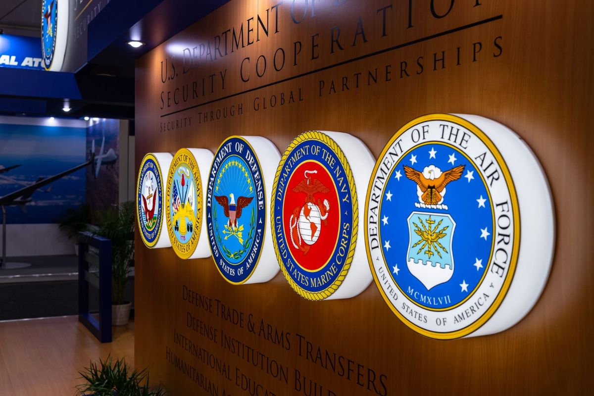 Wall with military department emblems.