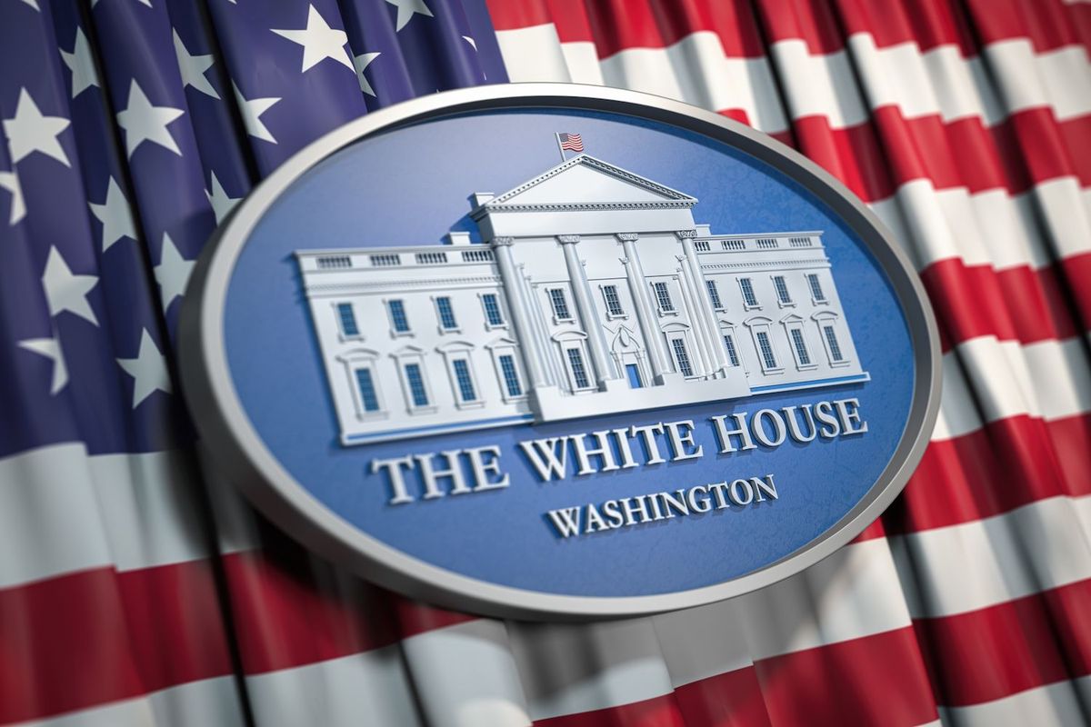 White House emblem on a flag backdrop.
