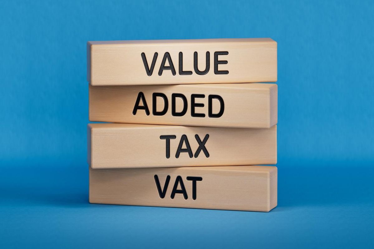 Wooden blocks stacked with words: Value Added Tax (VAT).