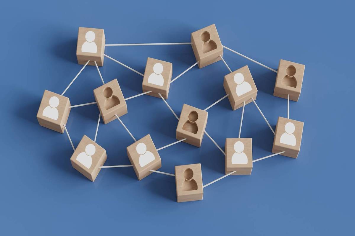 Wooden blocks with human icons are connected by white lines on a blue background.