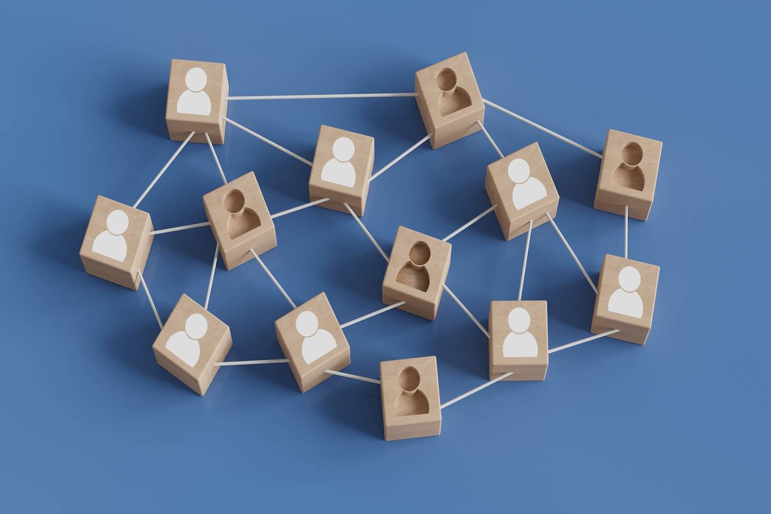 Wooden blocks with human icons connected by white lines on blue background.