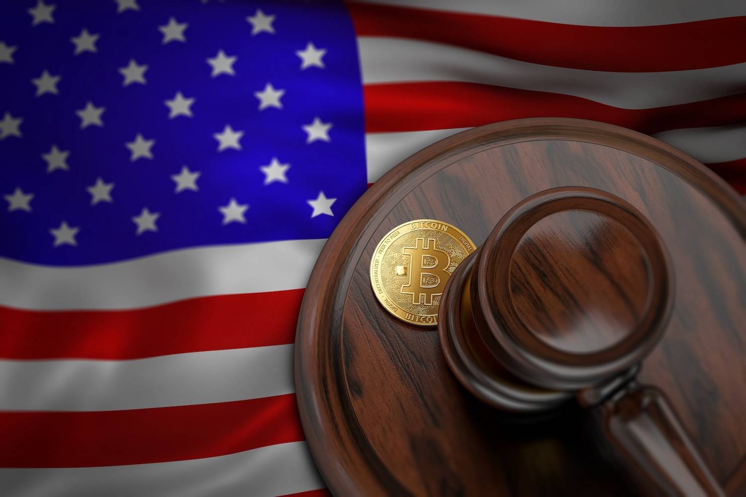 Wooden gavel and Bitcoin coin sit on a judge's block against waving American flag background.