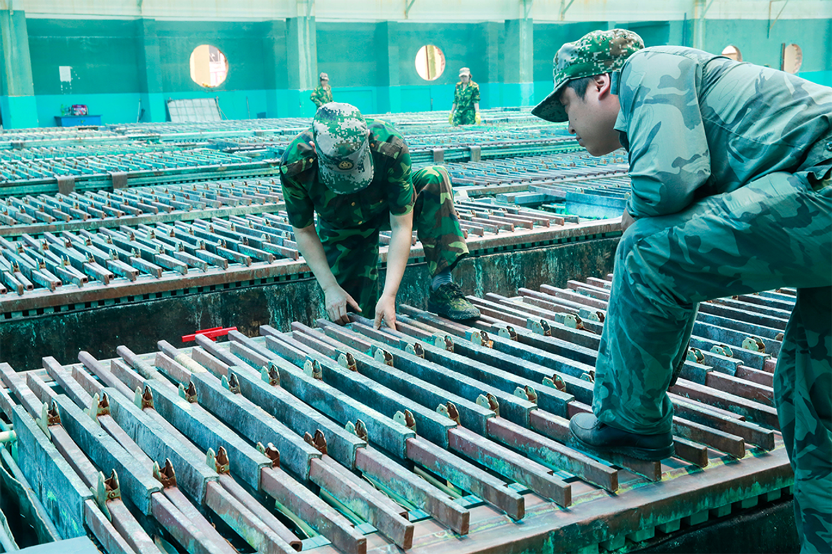Workers at rare earths facility.