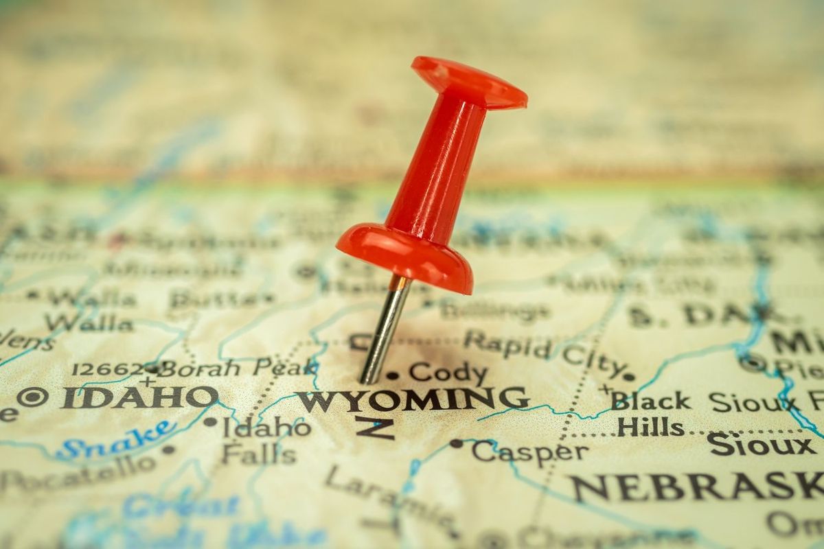 Wyoming pinned with a red tack on a map. 