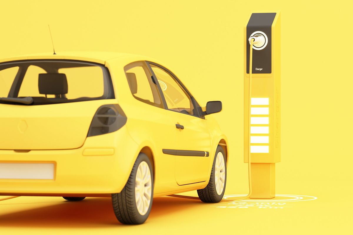yellow ev car at charging station