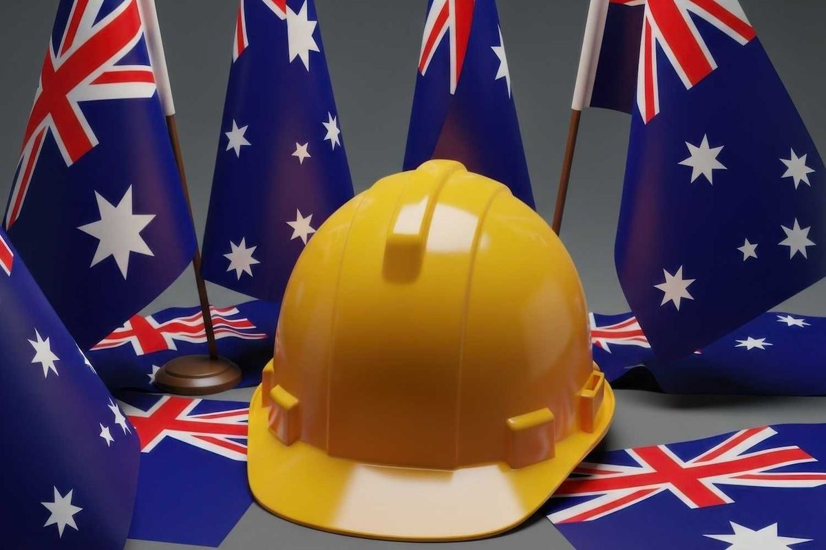Yellow hard hat surrounded by Australian flags.
