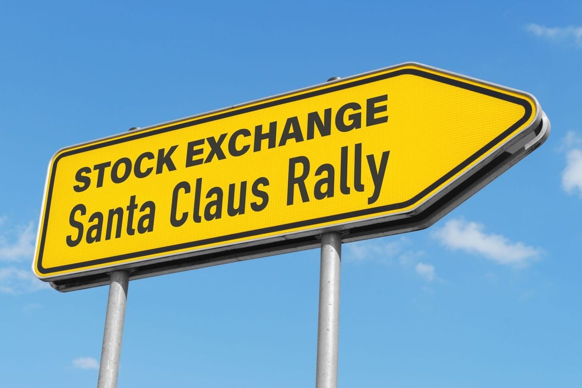 Yellow road sign shaped like arrow that says "Stock Exchange Santa Claus Rally."