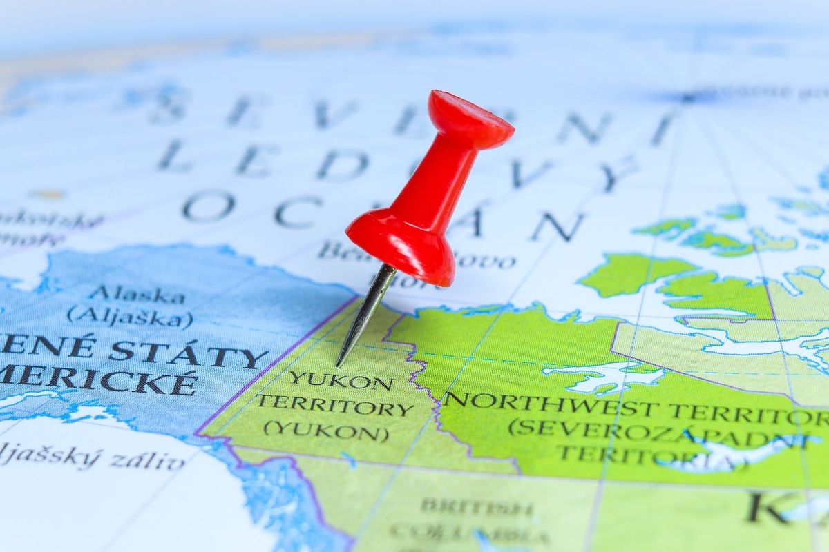 Yukon on map with red push pin.